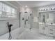 Modern bathroom featuring a soaking tub, walk-in shower, and double vanity at 1312 Pleasant Plains Rd, Matthews, NC 28105