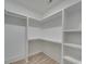 Large walk-in closet with built-in shelving and hanging rods at 1312 Pleasant Plains Rd, Matthews, NC 28105