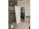 Main bathroom walk-in shower, tile floor, and walk-in closet at 13410 Old Camden Rd, Midland, NC 28107