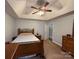 Spacious main bedroom with vaulted ceiling, ceiling fan, and carpeted floors at 13410 Old Camden Rd, Midland, NC 28107