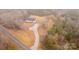 Aerial view of a single-story home with a driveway and surrounded by trees at 13570 Smith Ford Rd, Hickory Grove, SC 29717