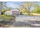 Exterior view of detached garage with driveway and surrounding trees at 137 Lancaster St, Chester, SC 29706