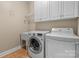 Laundry room with washer, dryer, cabinets, and utility sink at 170 Richards Landing Dr, Rock Hill, SC 29730