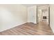 Empty bedroom with light wood-look flooring and white walls at 20105 Henderson Rd # J, Cornelius, NC 28031