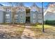 Inviting condo exterior with a paved walkway leading to the entrance at 20105 Henderson Rd # J, Cornelius, NC 28031
