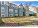 Charming two-story condo with green siding and landscaping at 20105 Henderson Rd # J, Cornelius, NC 28031