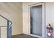 Condo entrance with a gray front door and decorative holiday items at 20105 Henderson Rd # J, Cornelius, NC 28031