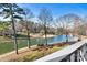 Scenic lake view with trees and buildings in the background at 20105 Henderson Rd # J, Cornelius, NC 28031