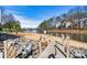 Lakefront with sandy beach, wooden walkway, and rope railing at 20105 Henderson Rd # J, Cornelius, NC 28031
