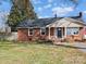 Inviting single-story home with a welcoming front porch and neat landscaping at 2204 Emmanuel Church Rd, Conover, NC 28613