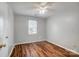 Spacious bedroom with wood-look floors and ceiling fan at 2321 Linda Lou Ct, Charlotte, NC 28213