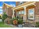 Inviting front porch with stone accents, perfect for relaxing at 2323 Barrowcliffe Nw Dr, Concord, NC 28027