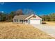 Newly built home with gray siding, beige accents, and a two-car garage at 2450 J B Denton Rd, Lancaster, SC 29720