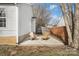 Cozy patio with two wooden chairs and a fenced yard at 3026 Hawick Commons Dr, Concord, NC 28027