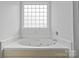 Relaxing bathroom with a large corner jetted tub at 3026 Hawick Commons Dr, Concord, NC 28027