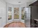 Kitchen with stainless steel refrigerator and bay window at 3026 Hawick Commons Dr, Concord, NC 28027