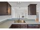 Kitchen with a breakfast bar overlooking the living room at 3026 Hawick Commons Dr, Concord, NC 28027