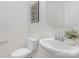 Powder room with pedestal sink, toilet, and modern fixtures at 3030 Beacon Ave # 81, Monroe, NC 28110