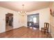 Bright dining room with hardwood floors and kitchen access at 309 7Th St Ne Pl, Conover, NC 28613