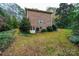 Brick home's side elevation showcasing a walk-out basement at 309 7Th St Ne Pl, Conover, NC 28613