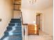 Entrance hall with staircase, wooden dresser, and tiled floor at 309 7Th St Ne Pl, Conover, NC 28613