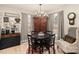 Eat-in kitchen area with a round dining table, stylish chandelier, and decorative hutch at 3713 Capricorn Rd, Lancaster, SC 29720