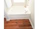 Clean white bathtub nestled in the corner with modern chrome fixtures at 5132 Stone Park Dr, Charlotte, NC 28269