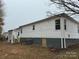 Exterior view of a single-story home with white siding and a gray foundation at 515 37Th Sw St, Hickory, NC 28602