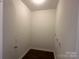 Empty laundry room with white walls and wood-look flooring at 515 37Th Sw St, Hickory, NC 28602