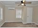 Spacious bedroom with ceiling fan, neutral walls, and wood-look flooring at 714 Webber Ave, Chester, SC 29706