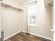 Small closet with wood floors and a window at 7741 Abigail Glen Dr, Charlotte, NC 28212