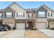 Charming two-story townhome with a one-car garage and inviting front porch at 8306 Hibiscus Ln, Fort Mill, SC 29707