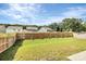 Spacious fenced backyard with green grass and a slight slope at 1051 Barnette Farm Ln, Monroe, NC 28110