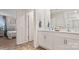 White double vanity in bathroom with tiled floors and view to bedroom at 12157 Lady Bell Dr, Charlotte, NC 28278