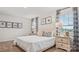 Bright bedroom with patterned curtains, matching bedding, and nightstands at 12157 Lady Bell Dr, Charlotte, NC 28278