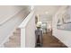 Welcoming foyer with staircase, wood floors, and view to dining area at 12157 Lady Bell Dr, Charlotte, NC 28278