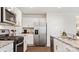 Spacious kitchen with stainless steel appliances, granite countertops, and white cabinets at 12157 Lady Bell Dr, Charlotte, NC 28278