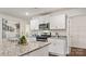 Stylish kitchen with white cabinetry, granite countertops, and a pantry at 12157 Lady Bell Dr, Charlotte, NC 28278