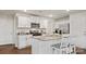 Well-appointed kitchen featuring white cabinets, granite countertops, and stainless steel appliances at 12157 Lady Bell Dr, Charlotte, NC 28278