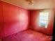 Pink bedroom with window, carpet, and minimal decor at 125 Crescent Heights Dr, Salisbury, NC 28146