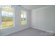 Bright, spacious bedroom with large windows and neutral carpeting at 2035 Skyhawk Dr, York, SC 29745