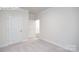 Spacious bedroom with plush carpet, white walls and crown molding at 2035 Skyhawk Dr, York, SC 29745