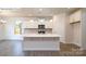 Modern kitchen with white cabinets, an island, and stainless steel appliances at 2035 Skyhawk Dr, York, SC 29745
