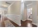 Hardwood floor hallway with powder room and wainscoting at 2491 Seagull Dr, Denver, NC 28037