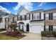 Charming two-story townhome with a white facade, black shutters, and attached garage at 255 Horizon Cir, Rock Hill, SC 29732