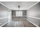 Dining room with updated light fixture and chair rail at 2916 Waycross Dr, Monroe, NC 28110