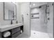 Modern bathroom featuring a walk-in shower, floating vanity, and gray tile at 3117 Colyer Pl, Charlotte, NC 28205