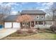 Brick two-story house with attached two-car garage and front porch at 3989 Shakespeare Dr, Hickory, NC 28601