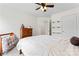 Bright bedroom with double windows, ceiling fan, and neutral carpeting at 9154 Snow Hill Ct, Charlotte, NC 28269