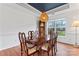 Formal dining room with a large table and view to backyard at 9154 Snow Hill Ct, Charlotte, NC 28269